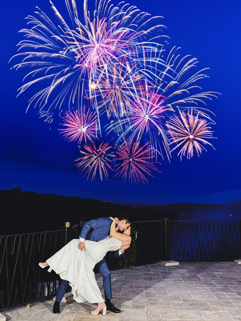 bride and groom portrait under firework